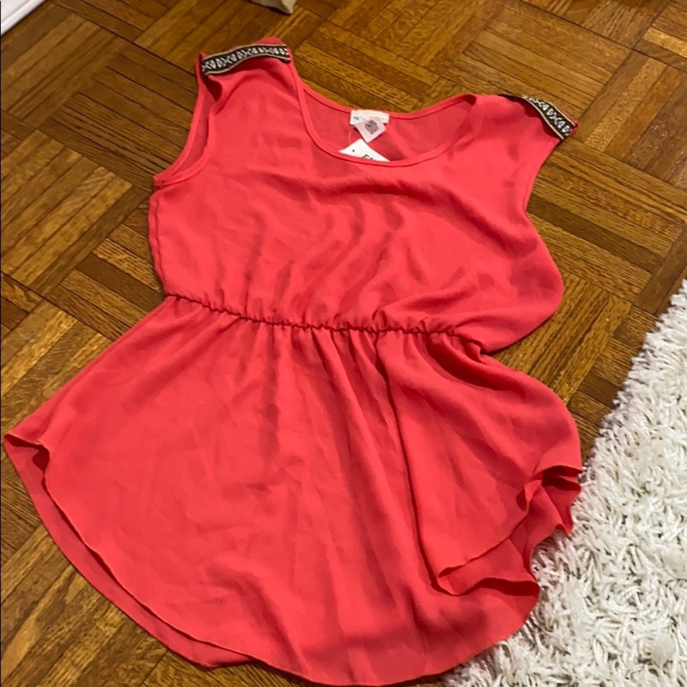 Coral blouse with shoulder detail